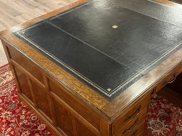 Antique Desk (partner desk) 410 - Classic English desk, Dark blue leather, Brass handles, light oak wood, ca. 1920s